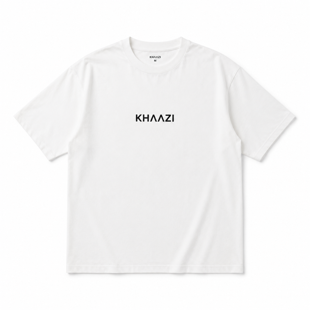 Khaazi women's white crew neck t-shirt with logo print, featuring a relaxed fit and minimalist casual design, styled in a modern studio setting.