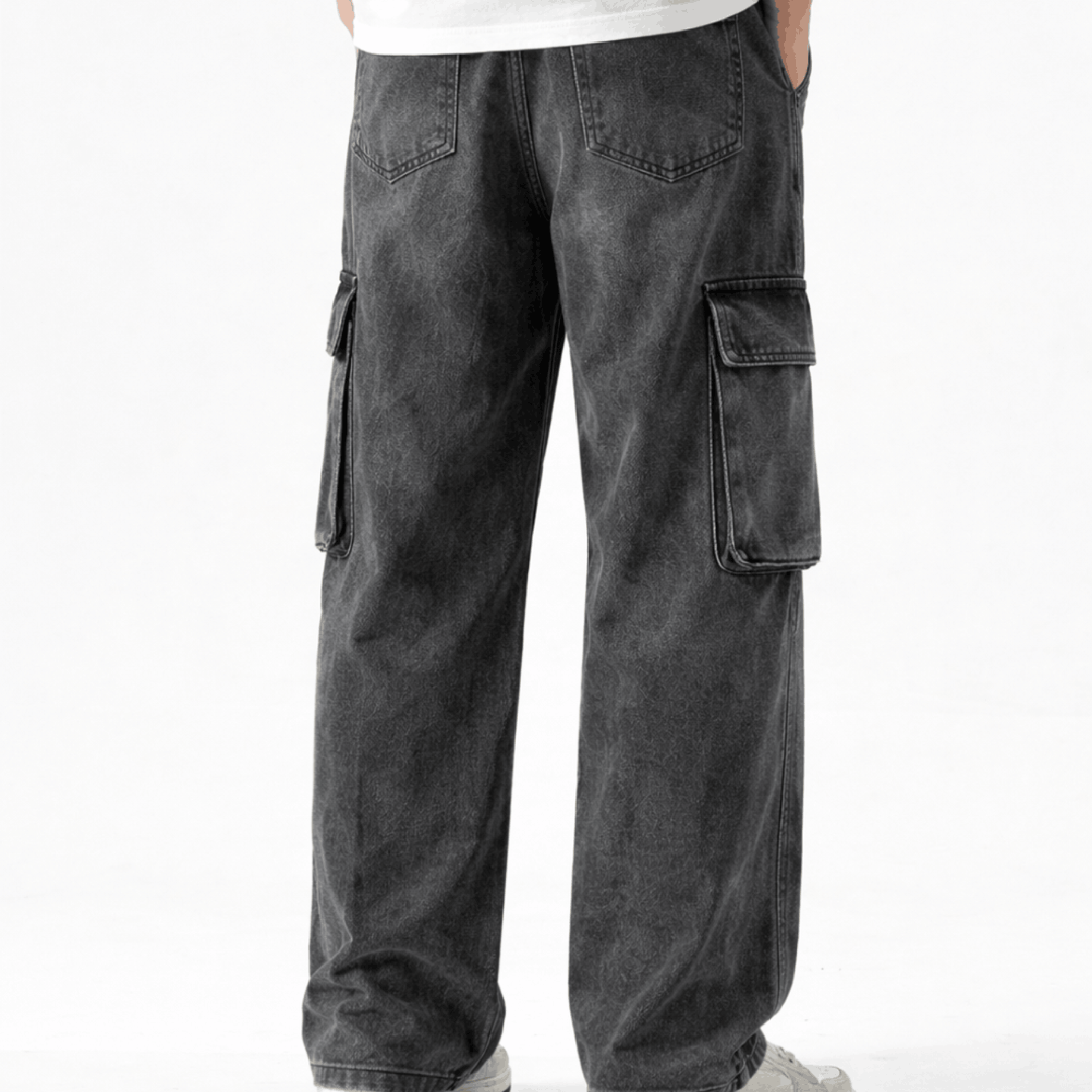 Washed black wide leg cargo jeans featuring multiple utility pockets, a relaxed baggy fit, and a vintage streetwear-inspired denim design for casual everyday wear.