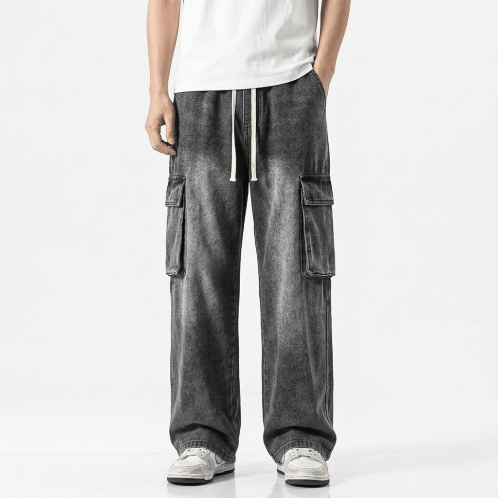 Washed black wide leg cargo jeans featuring multiple utility pockets, a relaxed baggy fit, and a vintage streetwear-inspired denim design for casual everyday wear.